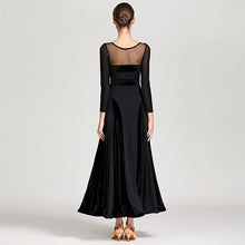 Load image into Gallery viewer, Woman standing straight up in a black dress with her back to the camera