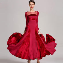 Load image into Gallery viewer, Woman in a red dress staring forward
