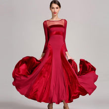 Load image into Gallery viewer, Woman in a red dress staring forward