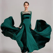 Load image into Gallery viewer, Woman in a flowing green dress with black panels