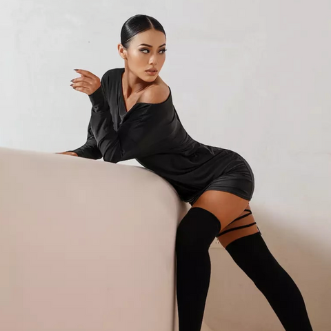 Woman posing in a small black dress